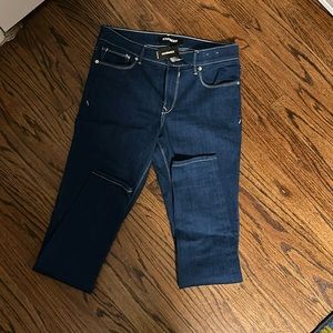 NEW express women’s stretch skinny jeans in a deep blue with white stitching.